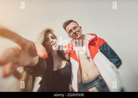 Trendy urban couple taking a selfie, young people lifestyle Stock Photo