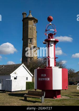 The High Lighthouse behind a colourful sea marker buoy in the Old Town of Harwich, Essex,  England, UK