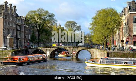 Amsterdam canal and boats in the Netherlands Stock Photo