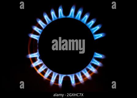 Hanover, Germany. 04th Oct, 2021. A gas flame burns on a kitchen stove in an apartment. Gas and electricity are more expensive in Europe than they have been for a long time. Credit: Hauke-Christian Dittrich/dpa/Alamy Live News Stock Photo