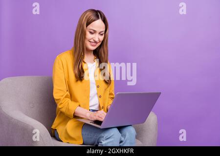 Profile side photo of business woman look read browse laptop virtual isolated over purple color background Stock Photo