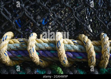 rope and crab pot on a quayside Stock Photo