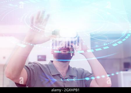 man trying virtual reality vr glasses at modern home with futuristic  neural network  dots graphic design Stock Photo
