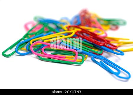 Lots of colorful paper clips against a white background Stock Photo