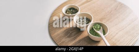 Green tea leaves selection chinese teas panoramic banner background Stock Photo