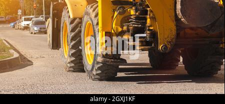 Heavy machinery, tractor on construction site, close-up to the big wheels, banner photo Stock Photo