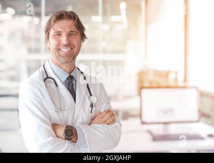 Portrait of smilling senior doctor of medicine in his ordination Stock Photo