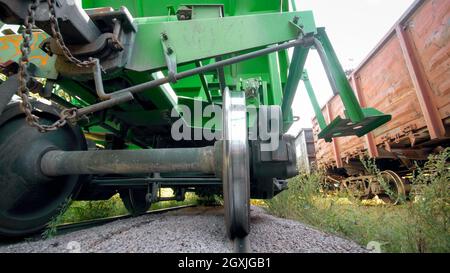 View underneath wagon on cargo train car on industrial railroad Stock Photo