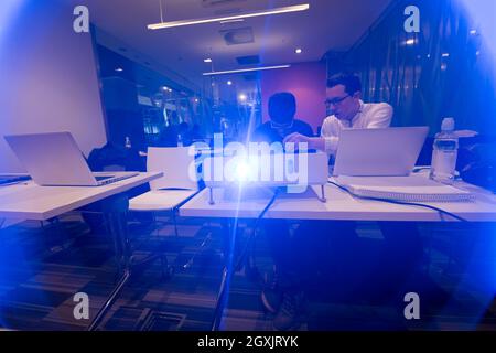 it students in computer science classroom  working together on project with mini pc hardware and code programming software on laptop Stock Photo