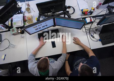top view of software developers writing programming code on computer ...