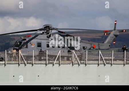 148826, a Sikorsky CH-148 Cyclone helicopter operated by the Royal Canadian Air Force, on board HMCS Fredericton (FFH-337), a Halifax-class (or City-class) frigate operated by the Royal Canadian Navy. The vessel is seen passing Greenock on the Firth of Clyde, as she heads out to participate in the military exercises Dynamic Mariner 2021 and Joint Warrior 21-2. Stock Photo