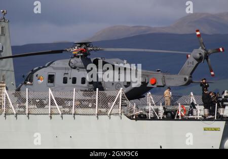 148826, a Sikorsky CH-148 Cyclone helicopter operated by the Royal Canadian Air Force, on board HMCS Fredericton (FFH-337), a Halifax-class (or City-class) frigate operated by the Royal Canadian Navy. The vessel is seen passing Greenock on the Firth of Clyde, as she heads out to participate in the military exercises Dynamic Mariner 2021 and Joint Warrior 21-2. Stock Photo