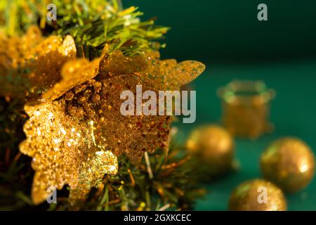 Christmas tree gold ornaments. Festive macro background. Beautiful toys on the branches. Sparkling bright blurred background bokeh copy space. Beautif Stock Photo