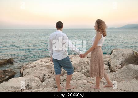Man and woman holding hands Stock Photo