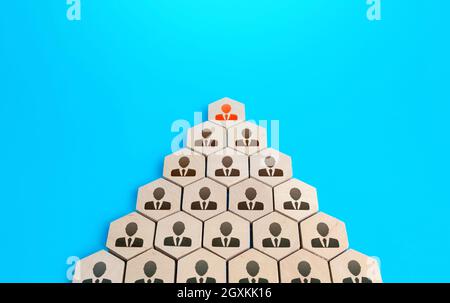 Leader on top of companys hierarchical pyramid. Traditional hierarchy concept. Superiors and subordinates. Meritocracy, corporate conformism. Personne Stock Photo