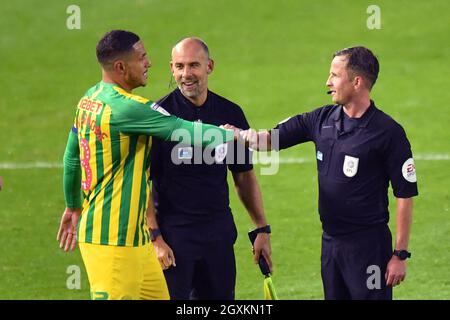 West Bromwich Albion's Jake Livermore touches fists with the match referee David Webb after the final whistle Stock Photo