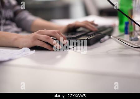 software developer writing programming code on computer Stock Photo