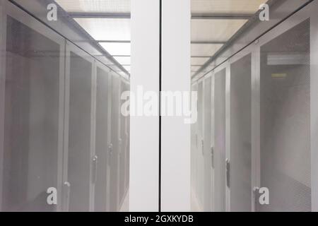 modern server room with white servers and hardwares in a internet data center Stock Photo