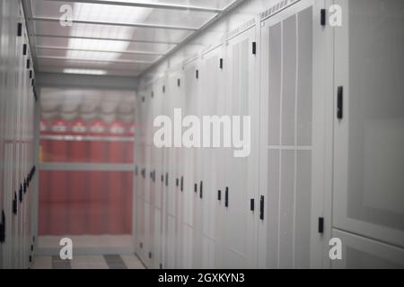 modern server room with white servers and hardwares in a internet data center Stock Photo