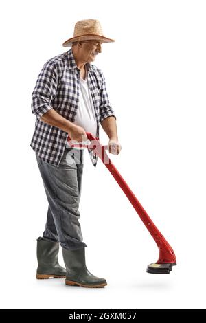 Full length shot of a mature man operating a grass trimmer isolated on white background Stock Photo