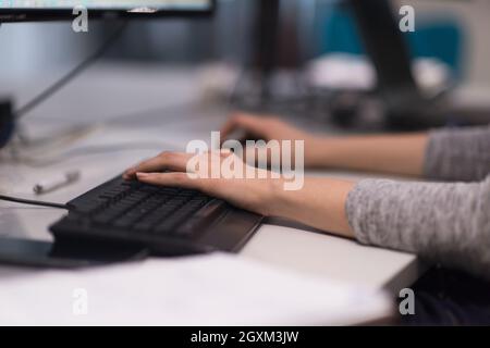 software developer writing programming code on computer Stock Photo