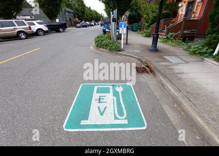 A street parking space reserved for electric vehicle charging located on Falls Ave SE, Snoqualmie, Washington. Stock Photo