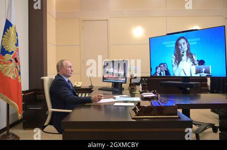 Novo-Ogaryovo, Russia. 05th Oct, 2021. Russian President Vladimir Putin chairs a video conference meeting with the winners of the Teacher of the Year All-Russian contest, from the Novo-Ogaryov state residence October 5, 2021 near Moscow, Russia. Credit: Alexei Druzhinin/Kremlin Pool/Alamy Live News Stock Photo