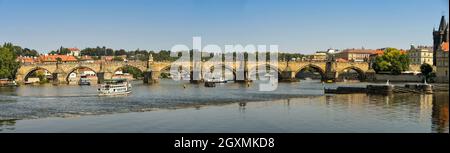 Prague, Czech Republic - July 2018: Panoramic view of the Charles Bridge over the River Vltava, which runs through the centre of Prague. Stock Photo
