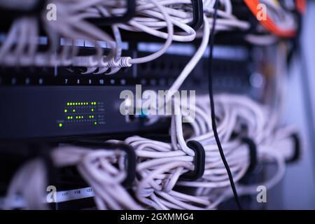 optical cables connected to the main server in the server room of the data center Stock Photo