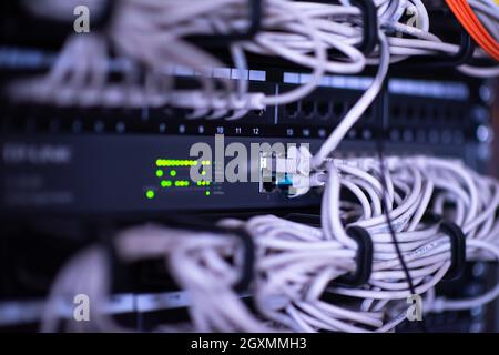 optical cables connected to the main server in the server room of the data center Stock Photo