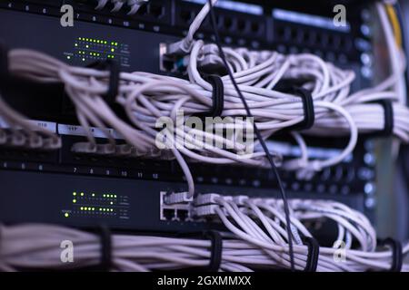 optical cables connected to the main server in the server room of the data center Stock Photo
