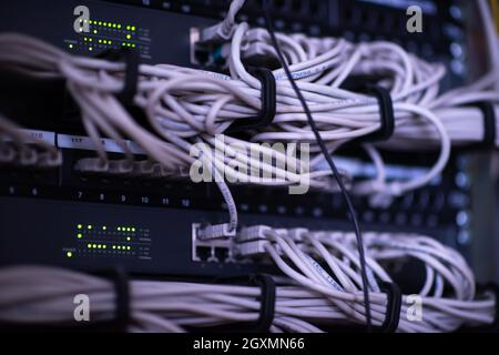 optical cables connected to the main server in the server room of the data center Stock Photo