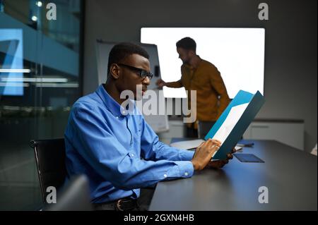 Two managers, IT idea presentation in office Stock Photo