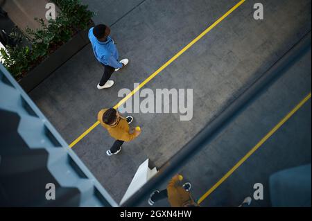 Two employees, top view from balcony in IT office Stock Photo
