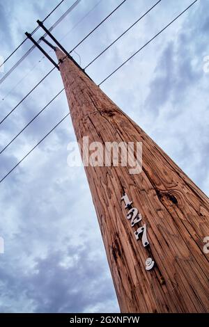 Telephone pole communications with dark clouds Stock Photo
