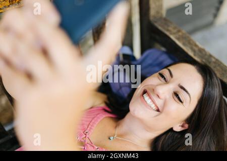 Positive millennial mobile phone user woman talking on video call Stock ...