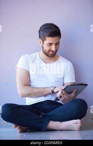 student working on tablet computer at university school modern interior Stock Photo
