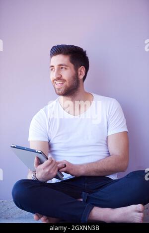 student working on tablet computer at university school modern interior Stock Photo