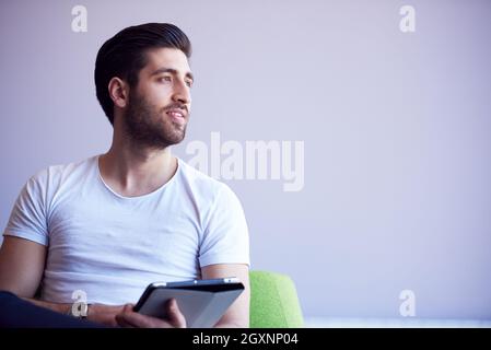 student working on tablet computer at university school modern interior Stock Photo