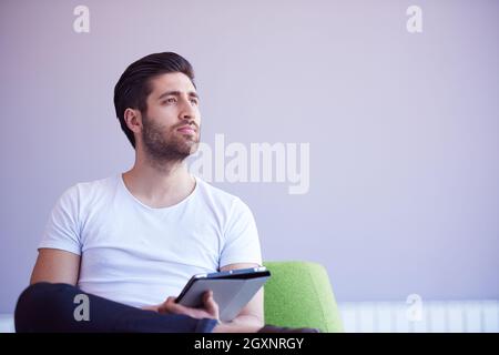 student working on tablet computer at university school modern interior Stock Photo
