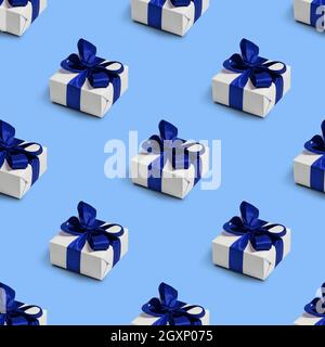 Seamless pattern with gifts on blue background. Christmas decorations. Stock Photo