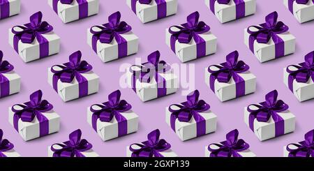 Seamless pattern with gifts on purple background. Boxing day. Stock Photo