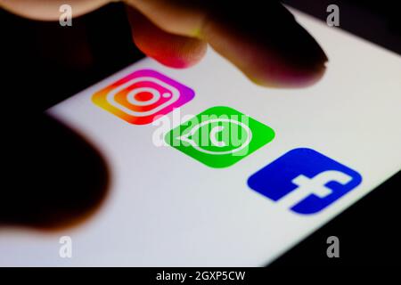 In this photo illustration the icon Instagram, WhatsApp and Facebook apps seen displayed on a smartphone. Stock Photo