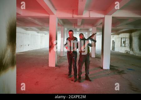 soldier squad team portrait in urban environment relaxed after action and battle Stock Photo