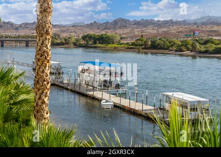 Laughlin, NV, USA – August 27, 2021: The USS Riverside boast docked on the Colorado River adjacent to Don Laughlin's Riverside Hotel and Casino in Lau Stock Photo