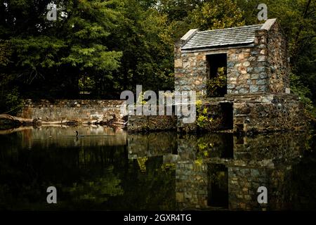 Tranquil speedwell lake park historic Ironworks building in Morristown, NJ Stock Photo