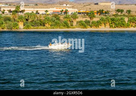 Laughlin, NV, USA – August 27, 2021: A group of people ride on a boat on the Colorado River in Laughlin, Nevada. Stock Photo