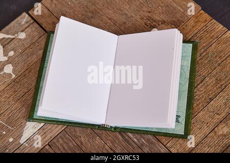 Blank open sketchbook on old wood Stock Photo