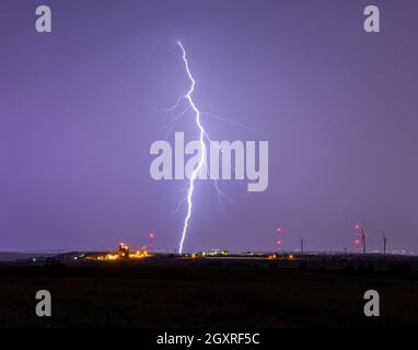 Intense lightning strike over cityscape Colorado, USA Stock Photo