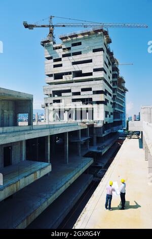 Team of architects people in group  on construciton site check documents and business workflow Stock Photo